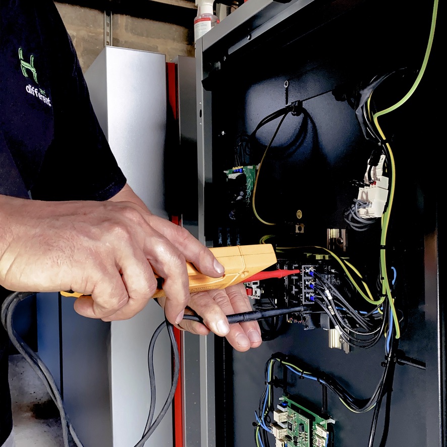 engineer working on a heat pump